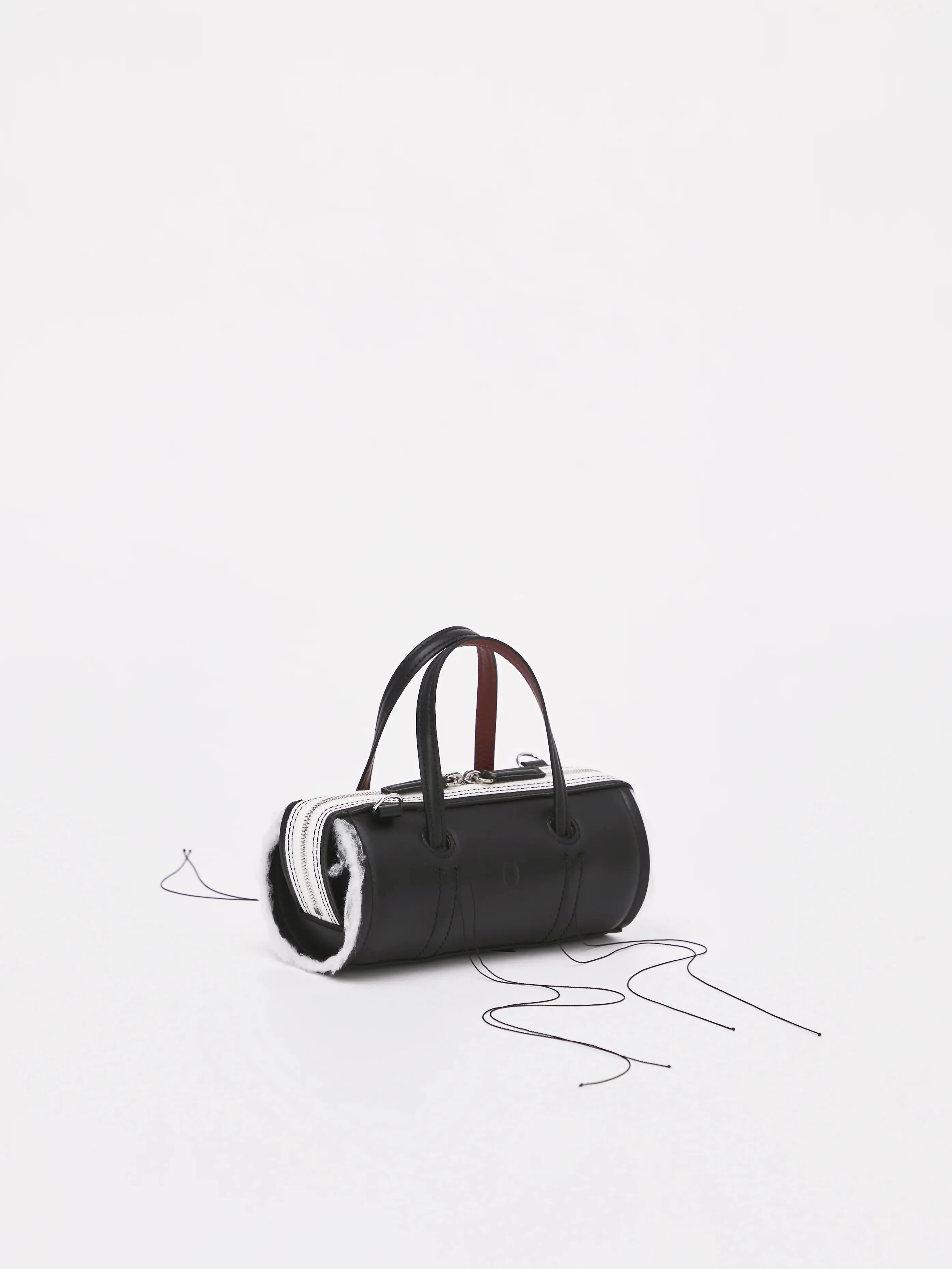 Anona Cylinder Bag in Black by Dentro